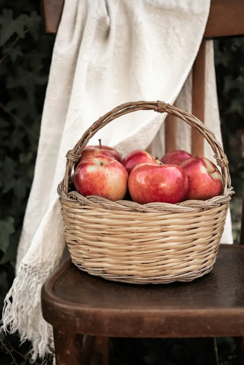 Red apples in a wicker basket