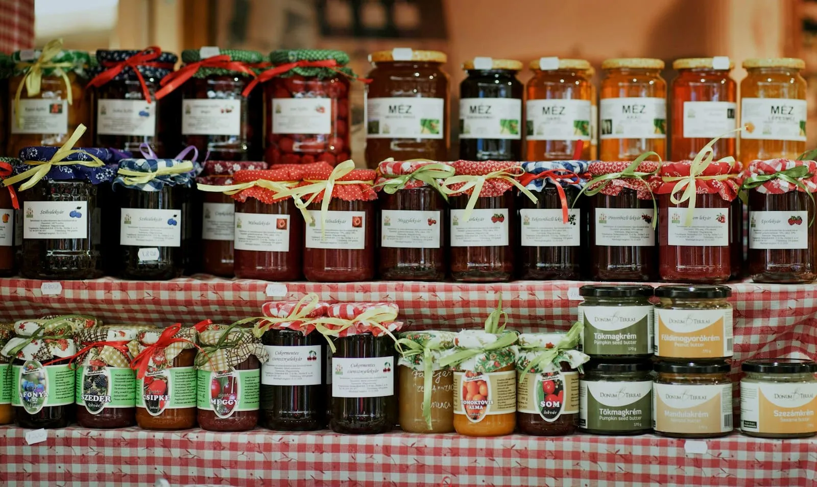 Rows of jam jars on a market stall