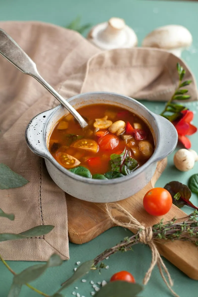 A bowl of tomato and vegetable soup